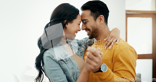 Image of Couple, forehead touch and hug in living room with love, bonding and happy people together at home. Healthy relationship, trust and support in commitment, partner and dancing, romance and intimacy