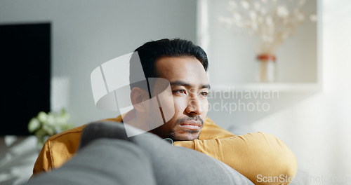 Image of Thinking, memory and sad asian man on a sofa with nostalgia, depression or grief in his home. Burnout, worry and Japanese male in living room with broken heart, mourning or anxiety for loss and debt