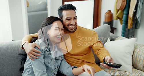 Image of Couple, smile and watch movies on tv, news and cable show for media broadcast on sofa at home. Happy man, woman and people change television remote for streaming multimedia, subscription and comedy