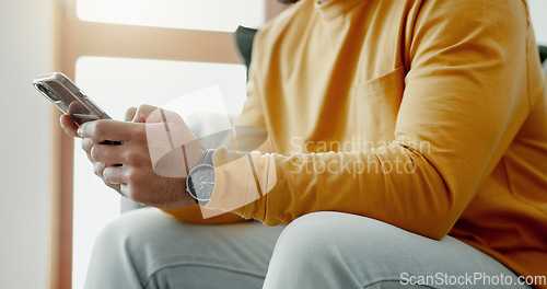 Image of Hands, phone texting and home with social media post, networking and online on a sofa. Mobile app, chat message and typing on a living room couch with digital entertainment and tech in a house