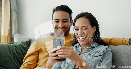 Image of Couple, laugh and talking on sofa with phone for social media post, subscription and reading funny notification. Happy man, woman and scroll on smartphone for meme, web app and relax in living room