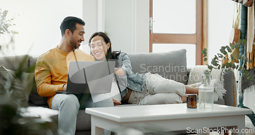 Image of Couple, laptop and laugh on sofa in home for meme, watch movies and streaming funny multimedia. Happy man, woman and relax at computer in living room on social media, web subscription or comedy show