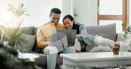 Image of Couple, laptop and laugh on sofa in home for meme, watch movies and streaming funny multimedia. Happy man, woman and relax at computer in living room on social media, web subscription or comedy show