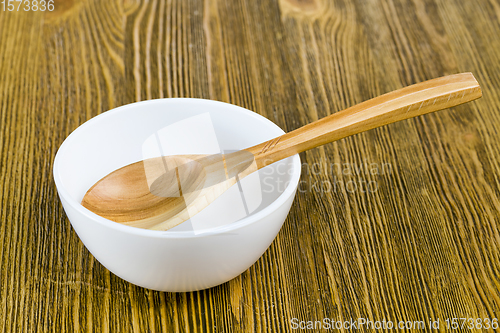 Image of wooden spoon in a bowl