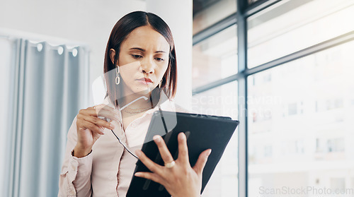 Image of Woman in office, reading and thinking with tablet for email, HR schedule or report online for feedback. Research, networking and communication on digital app, businesswoman at human resources agency.