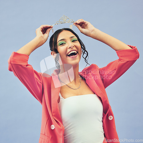 Image of Fashion, beauty and portrait of woman with crown in studio for glamour, luxury and winning prize. Excited, wow and person with tiara for princess pageant, winner and cosmetics on purple background