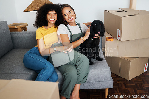 Image of Homeowner, portrait and lesbian couple with a dog on the sofa for moving boxes and a new home. Smile, lgbt and women or people on the living room couch of an apartment with a pet after relocation