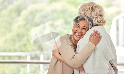 Image of Love, hug and old woman friends on space together for a visit during retirement in a senior home. Portrait, smile and happy elderly people embracing for support, unity or solidarity while bonding