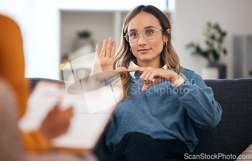 Image of Sign language, speech therapy and woman talking to therapist in a consultation or counseling conversation. Communication, support and professional psychologist help person learning and speaking