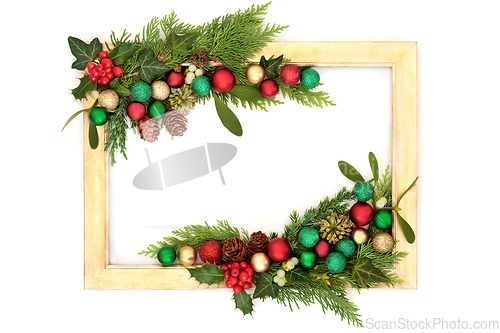 Image of Christmas Colorful Bauble and Winter Greenery Background Frame