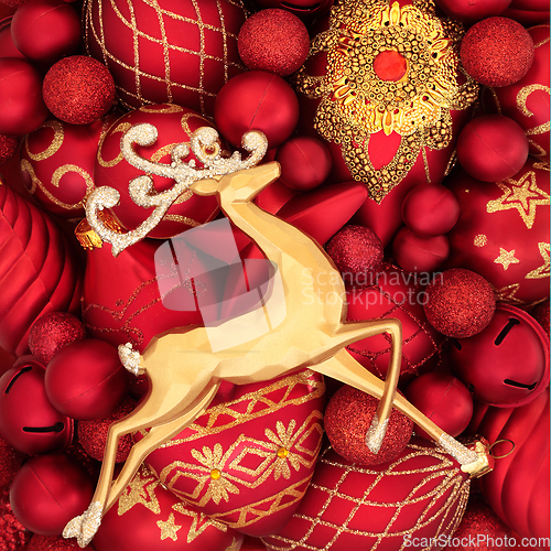 Image of Christmas Reindeer and Red and Gold Bauble Background