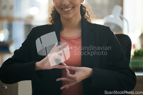 Image of Hand gesture, corporate and woman at work for communication, sign language or working. Smile, office and employee, person or worker gesturing for conversation, talking or connection in the workplace