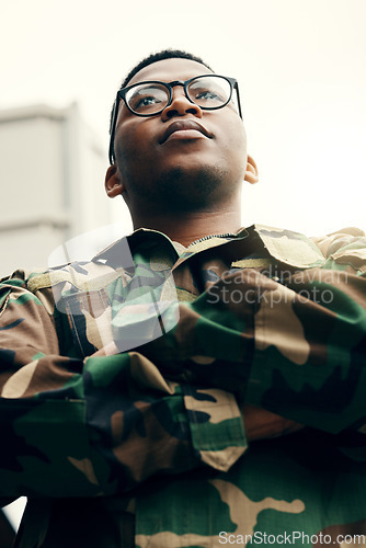 Image of Thinking, outdoor and black man with arms crossed, military and leadership with solution for peace, honor and problem solving. African person, soldier and employee with ideas, leadership and power