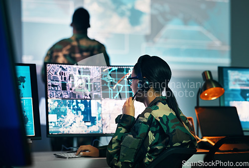 Image of Military command center, computer screen and woman in surveillance, headset and tech for communication. Security, world satellite map and soldier at monitor in army office at government control room.