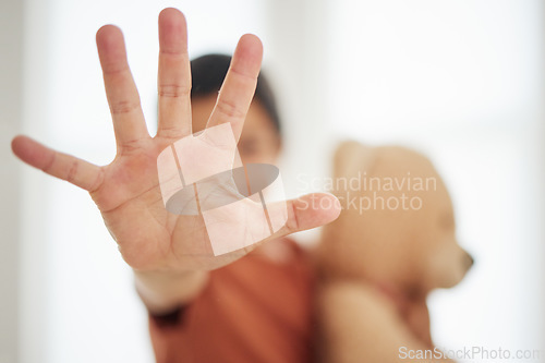 Image of Hand, child and palm with stop for violence, abuse and warning sign in support for harassment and protection. Person, kid and no gesture for protest, fight or defence expression with empowerment