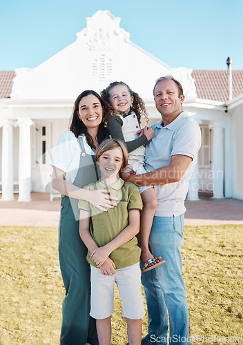 Image of Happy family, portrait and real estate on grass in new home, property or investment on outdoor lawn. Mother, father and kids smile for moving in, house or bonding in happiness or embrace together