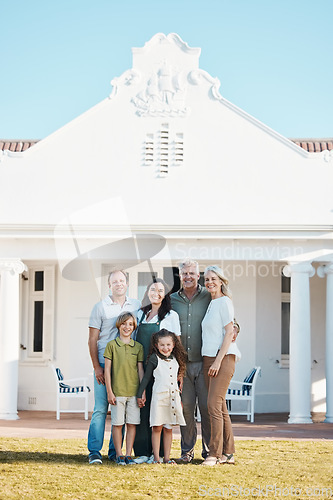 Image of Happy big family, portrait and hug in new home on lawn, property or investment on outdoor grass. Parents, grandparents and children smile for moving in, house or happiness in real estate together