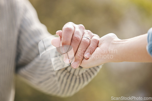 Image of Couple, holding hands and people with trust in nature, garden or backyard with support, care or love for partner. Solidarity, together or help with respect in partnership, marriage or commitment