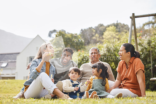 Image of Big family, grandparents and children for picnic, relax and bubbles on grass or garden outdoor in summer. Love, people and kids in backyard of home for care, freedom and bonding in nature or park
