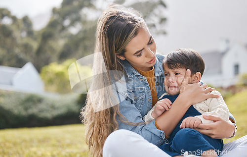 Image of Outdoor, mother and kid crying, sad and comfort with pain, injury and support with unhappy expression. Family, mama and child in a backyard, upset and compassion with care, console and depression