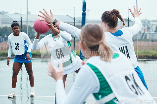 Image of Netball sports team, game ball and women defend, attack and pass in community competition, practice and game. Exercise, group action and player workout, tournament match or athlete training on court