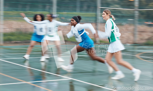 Image of Sports, training and team netball competition, practice and women playing game, court challenge or action match. Fast motion blur, speed and group cardio workout, player teamwork and athlete running