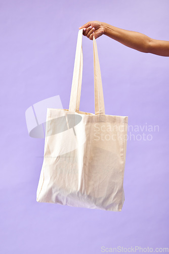 Image of Sustainability, shopping and eco friendly bag by person or recycling customer isolated in a studio purple background. Environment, retail and woman with carbon footprint, zero waste and grocery