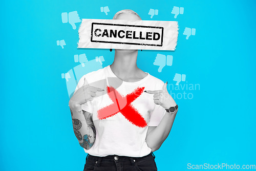 Image of Cancel culture, woman and text overlay with graphic and bad emoji for social media ban in studio. Blue background, cross and dislike banner with online public shame with accountability and protest
