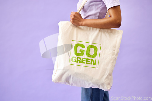 Image of Sustainable, shopping and eco friendly bag by person or recycling customer isolated in a studio purple background. Environment, retail and woman with carbon footprint, zero waste and grocery