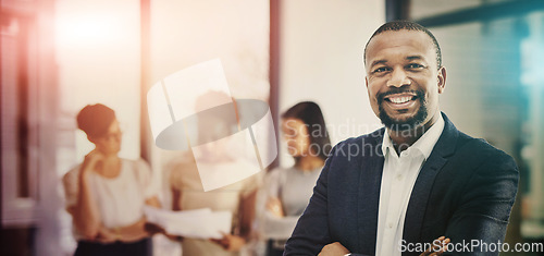 Image of Business man, smile and portrait with leadership, working and work confidence in a office. African male professional, manager and happy worker in a corporate workplace with arms crossed and staff