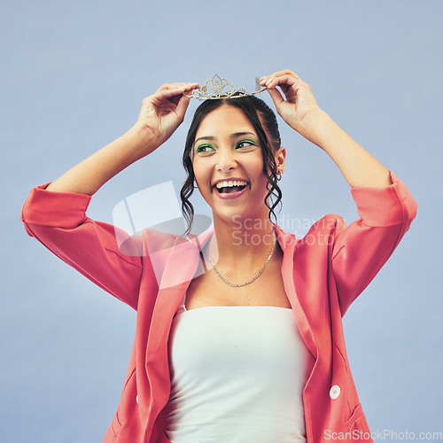 Image of Fashion, beauty and woman with tiara in studio for glamour, luxury and winning prize. Excited, wow and isolated person with crown for princess winner, pageant and cosmetics on purple background