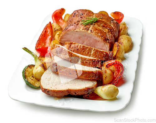 Image of sliced roast pork with vegetables