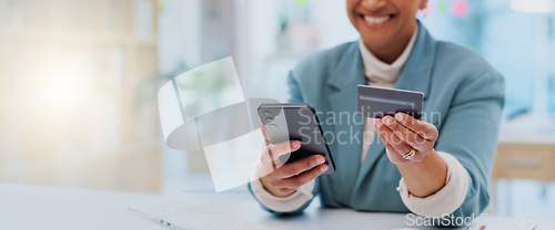 Image of Credit card, payment and phone with hands of woman in office for fintech, online shopping an investment. Ecommerce, savings and banking app with closeup of employee for business, website and finance