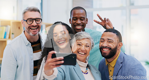 Image of Creative people, selfie and team building in meeting for photo, memory or vlog at the office. Goofy, silly or humor group smile in teamwork for funny picture, social media or startup at the business