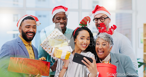 Image of Creative people, Christmas and selfie for party celebration, festive season or December holiday at office. Happy group of employees smile at work event for gifts, surprise or photo in memory and vlog