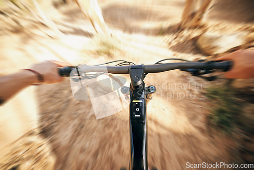 Image of POV, mountain bike and cycling, man with speed for sports and training in fast adventure. Professional dirt race action, off road bicycle handlebars at competition or performance challenge in woods.