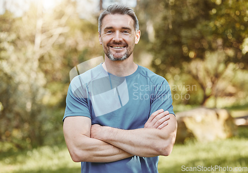 Image of Senior, fitness and portrait of man with arms crossed in a park happy with workout, running or results. Exercise, face and elderly male runner smile in forest for training, workout or body challenge