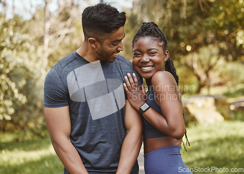 Image of Fitness, park and portrait of couple hug outdoors for exercise, training and running for cardio workout. Dating, happy and interracial man and woman smile for wellness, health and sports in nature