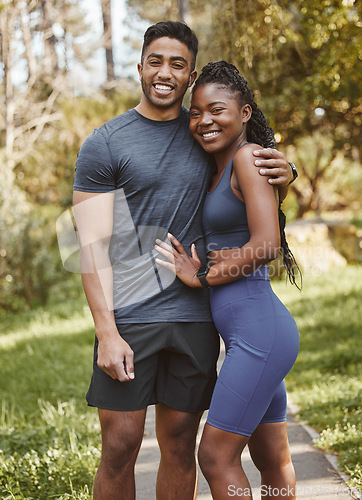 Image of Fitness, nature and portrait of couple hug outdoors for exercise, training and running for cardio workout. Dating, happy and interracial man and woman embrace for wellness, healthy body and sports