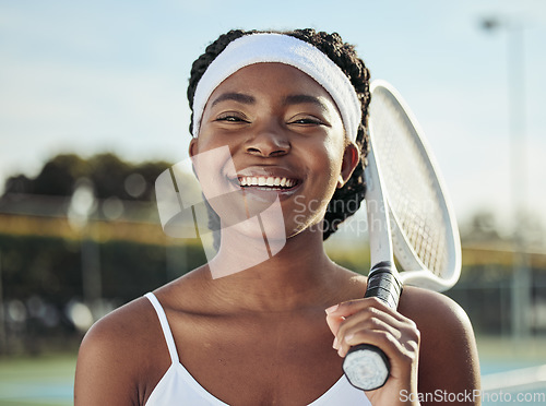 Image of Sports, smile and portrait of woman tennis player with a racket practicing to play a match at stadium. Fitness, happy and young African female athlete with equipment training on court for tournament.