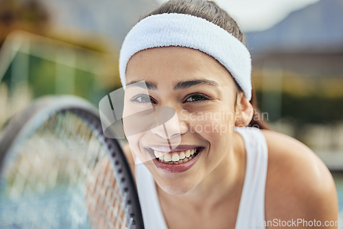 Image of Badminton, portrait and woman tennis player with a racket practicing to play a match at stadium. Fitness, sports and professional female athlete with equipment for training on court for tournament.