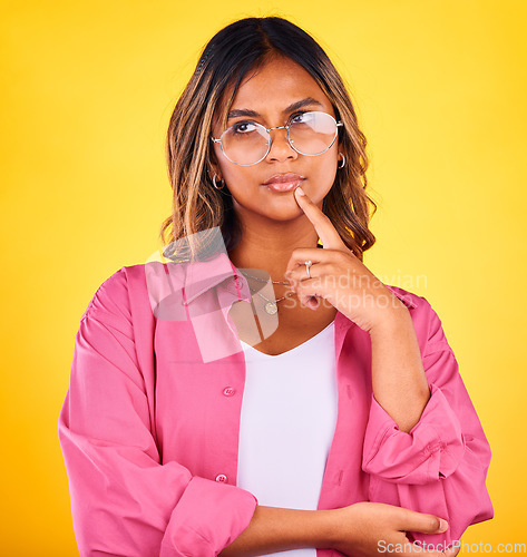 Image of Thinking, inspiration and woman in glasses with ideas in studio, future or dream with solution on yellow background. Decision, question with problem solving and insight with memory for brainstorming