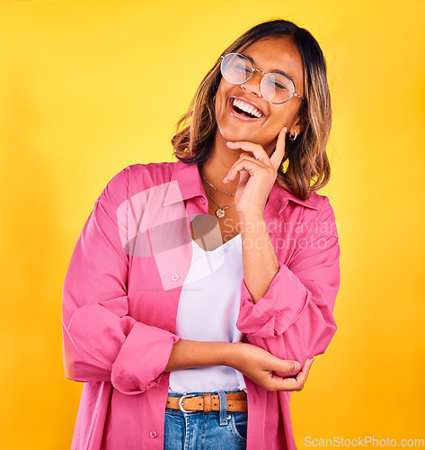 Image of Happy, laugh and face of woman on yellow background with smile, laughter and cheerful. Fashion, style and isolated person with funny joke in trendy clothes, stylish outfit and glasses in studio