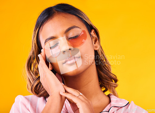 Image of Woman, eye mask and beauty with skincare, dermatology and cosmetic product on yellow background. Peace, calm and self care treatment with patch, facial for antiaging with glow and wellness in studio