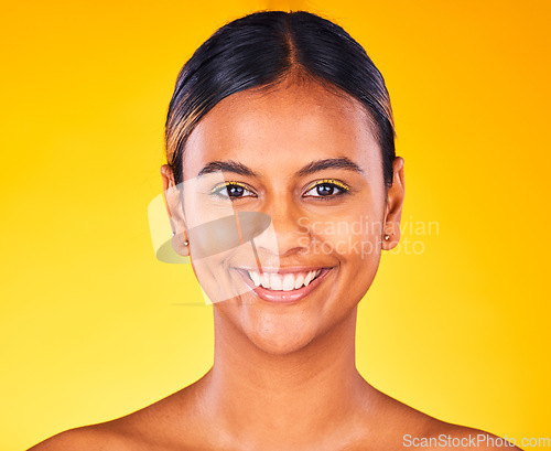 Image of Woman, face and beauty with skincare, dermatology and natural cosmetics on yellow background. Portrait, smile and self care treatment with facial for antiaging, skin glow and wellness in studio