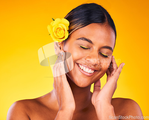 Image of Cosmetic, flower and young woman in studio with beauty, glow and skincare face routine. Makeup, rose and female model from Mexico with facial dermatology treatment isolated by yellow background.