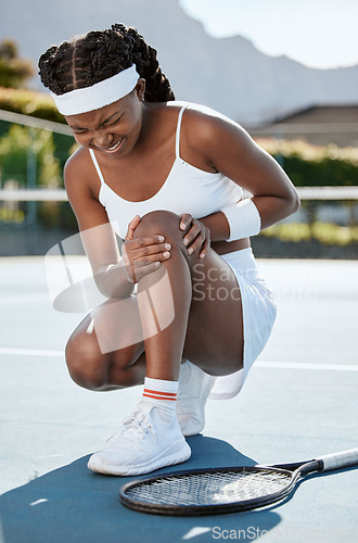 Image of Sports, tennis and black woman with knee injury, medical crisis or first aid problem, mistake or broken leg, joint pain or risk. Hurt African player, court and workout accident from training practice