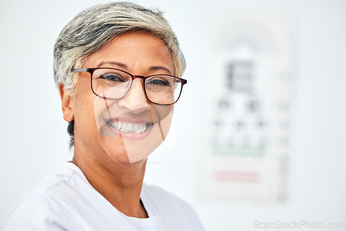 Image of Senior woman, face and smile with glasses, vision and eye care in optometry clinic for eyesight test and chart. Happy in portrait, glaucoma and frame with prescription lens eyewear and mockup space