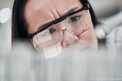 Image of Test tubes, scientist and confused woman closeup with investigation, thinking and science research. Laboratory, clinic professional and healthcare worker with medicine and liquid check for test