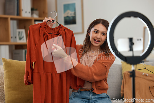 Image of Influencer woman, show clothes and live stream with ring light, review and talking on social media app. Girl, fashion and web chat with presentation, feedback and broadcast with suggestion in home